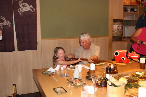 Luna And Dad Holding One Of The Long Serving Utensils