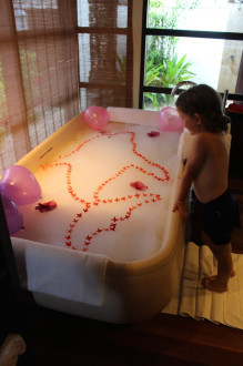 this bath was made for Luna by the staff! they used flowers to create a dolphin in the tub!