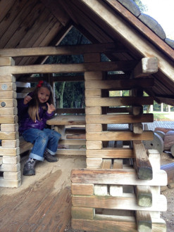 Luna loved playing in this log cabin that we found
