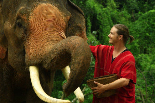 Josh feeding his elephant, Bunjin
